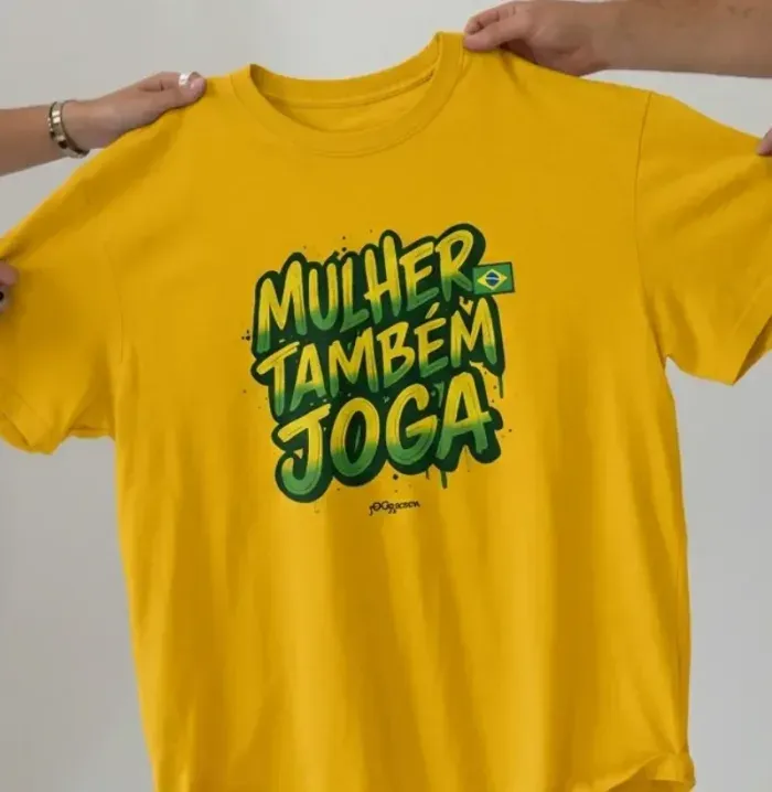 camiseta amarela "mulher também joga"